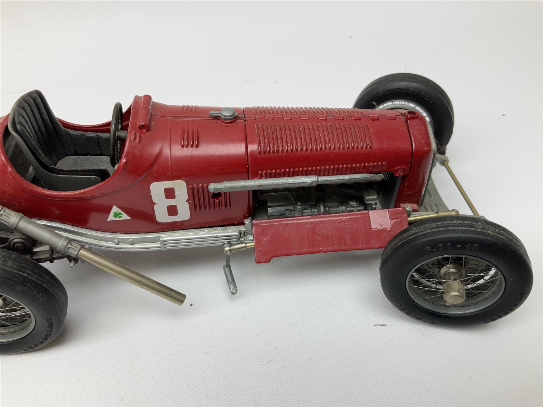 Four Franklin Mint Precision Models, one with hardwood body; large reproduction model of a vintage racing car L52cm; and four other modern metal/wooden models of vintage cars; all unboxed (9)