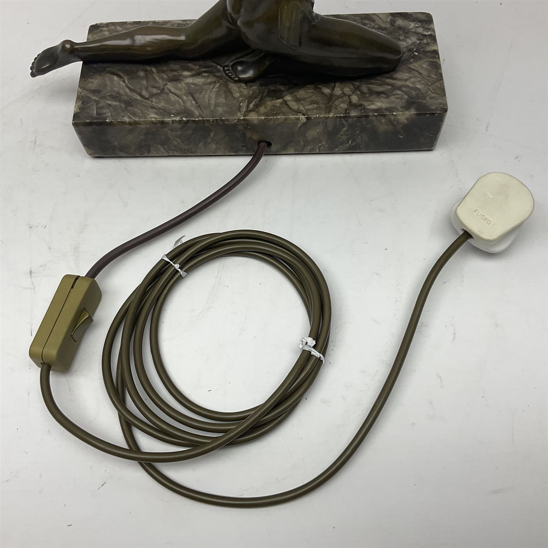 1930s Art Deco spelter table lamp, modelled as a nude woman holding aloft a spherical crizzled glass shade, upon a marble base, H48cm