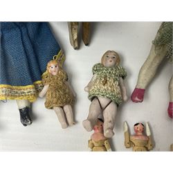 Twelve miniature bisque, bisque headed and wooden dolls to include articulated examples, tallest 12cm 