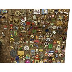Very large quantity of metal and plastic pin badges, loose and mounted on cork panels, including many from the USA, some dated 1980s and 1990s