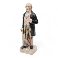 19th Century Staffordshire pearlware figure modelled as Jupiter stood beside a raven, stood upon a faux marble base, painted in bright polychrome enamels, H28cm together with a Staffordshire figure of William Ewart Gladstone (2)