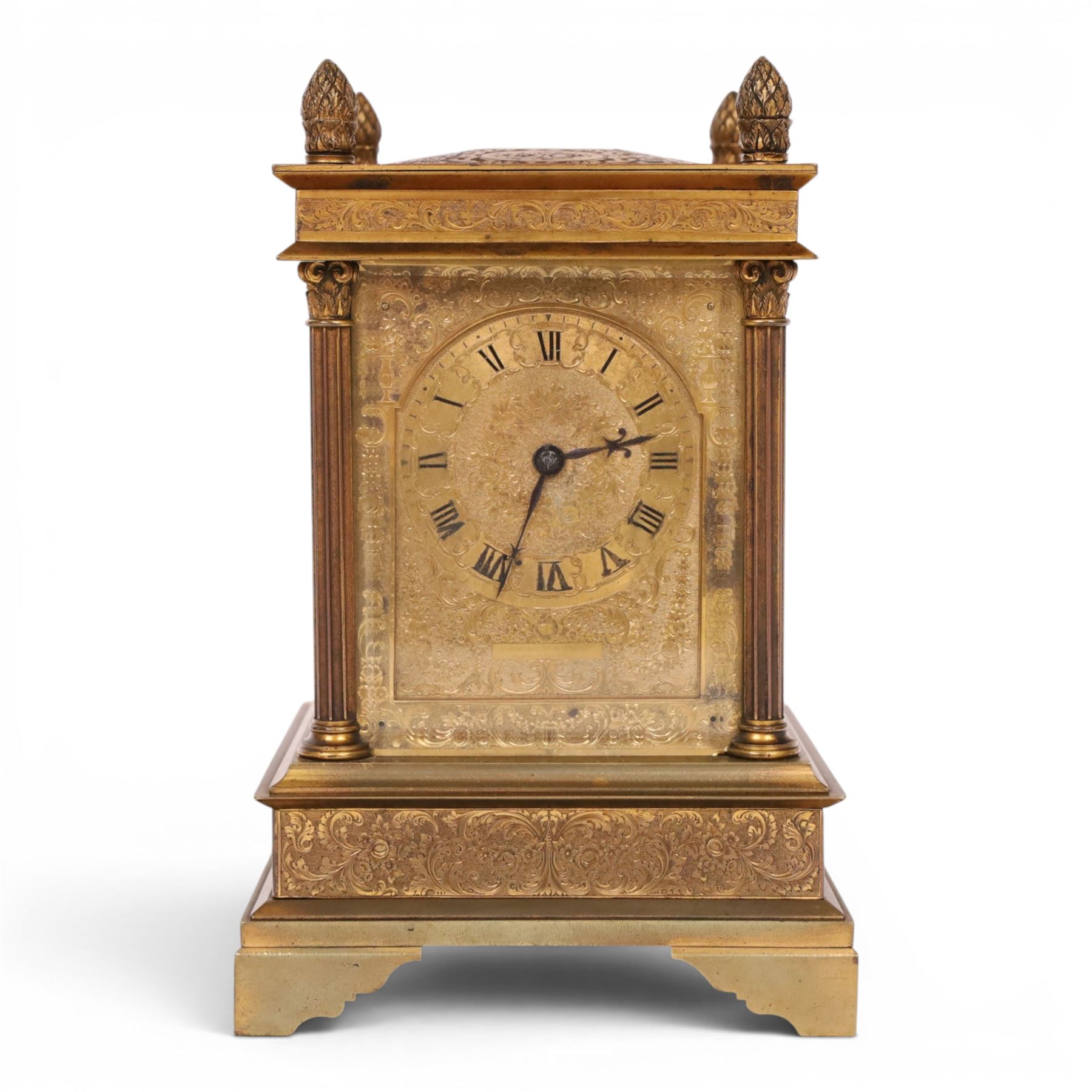 Early 20th century brass mantle clock, the face and case profusely engraved with floral scrolls, the sides inset with hunting scene panels, flanked by four Corinthian columns with acorn finials, striking the hours and halves on bell, H20.5cm W13cm