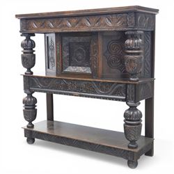 Jacobean revival oak side cabinet, rectangular top above carved frieze of stylised foliage and lunettes, fitted with a central cupboard doors with applied carved panels, above a frieze drawer, supported on turned and carved vase-shaped supports, united by stretcher tier and lower shelf