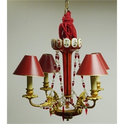  Four light gilt metal electrolier with cranberry white overlay lustre column and matching faceted ruby and clear drops, H41cm  