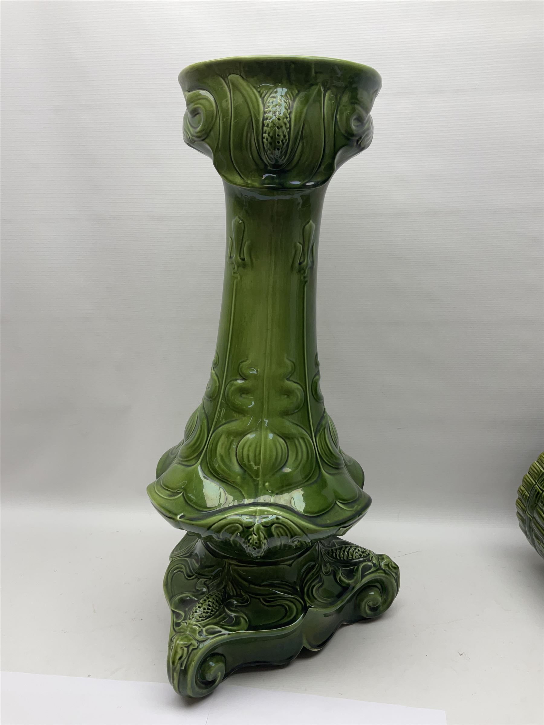 Jardiniere and stand, the jardiniere modelled as a pale, the stand with foliate and foliage decoration on a green ground, stand H73cm 