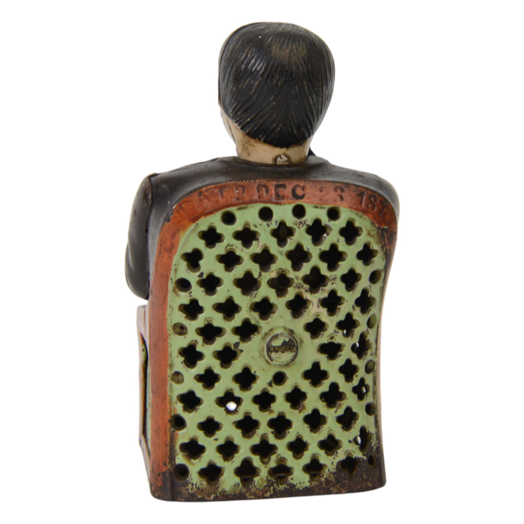 Late 19th century American cast iron Tammany mechanical money box, modelled as a suited gentleman with yellow waistcoat seated in a red and green chair, with two patent marks for Dec 23rd 1873 and June 8th 1875, H14cm