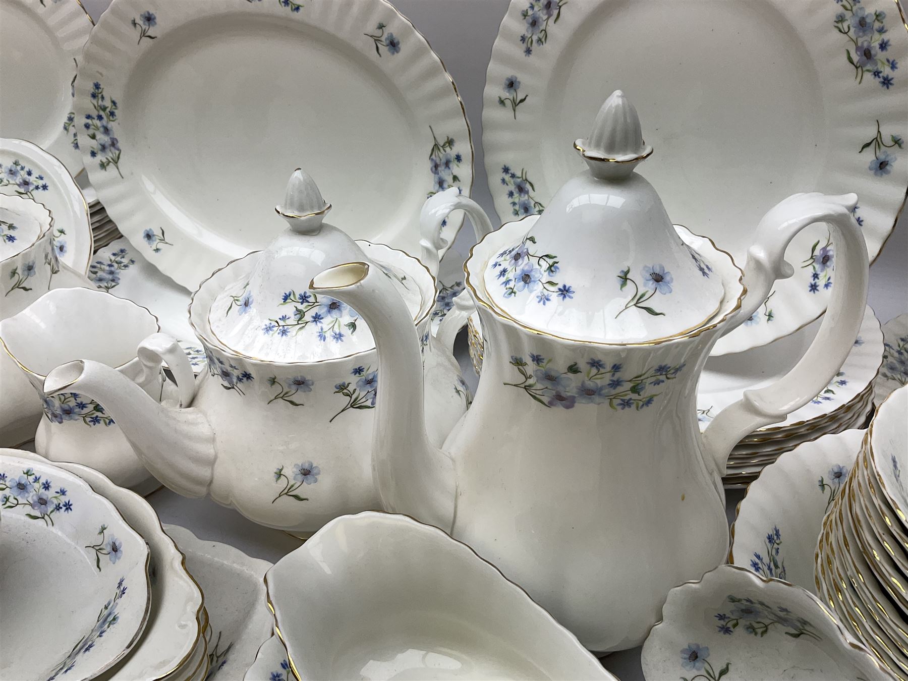 Extensive Richmond Blue Rock pattern part tea and dinner service, to include seven dinner plates, nine smaller plates, three lidded twin handled tureens, two teapots and two coffee pots, eleven bowls, cake stand, six twin handled soup bowls and saucers, six teacups, four coffee cups, milk jugs, sucrier, cake plate, salt and pepper shakers, other plates, dishes, bowls, side plates and many spares etc