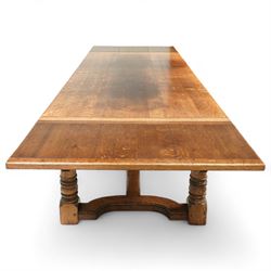 17th century design oak refectory extending dining table, the rectangular planked top with cleated ends, with two concealed leaves, raised on turned baluster supports united by shaped stretchers (Extends to 331cm)