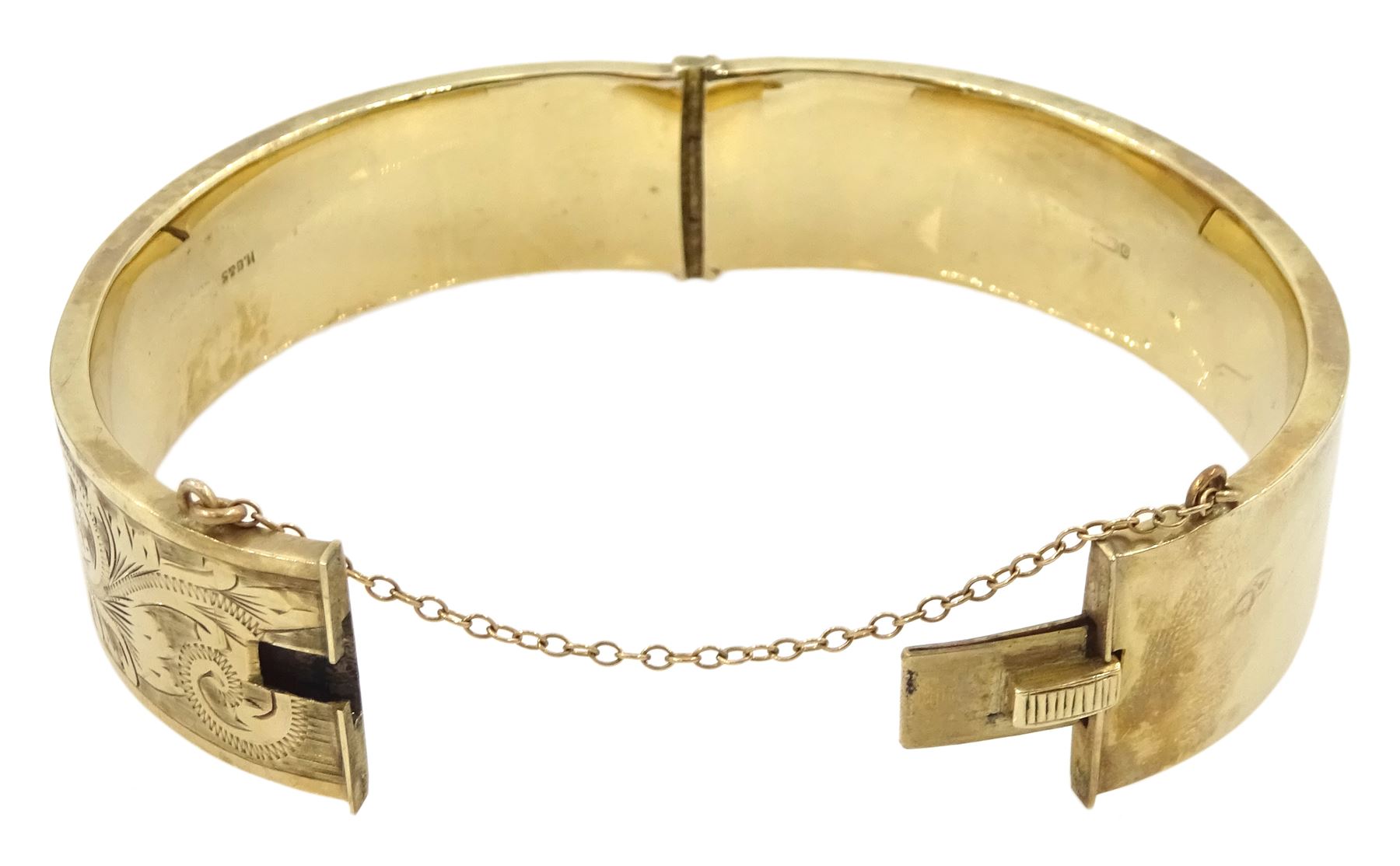 9ct gold hinged bangle with bright cut decoration by Henry Griffith & Sons Ltd, Birmingham