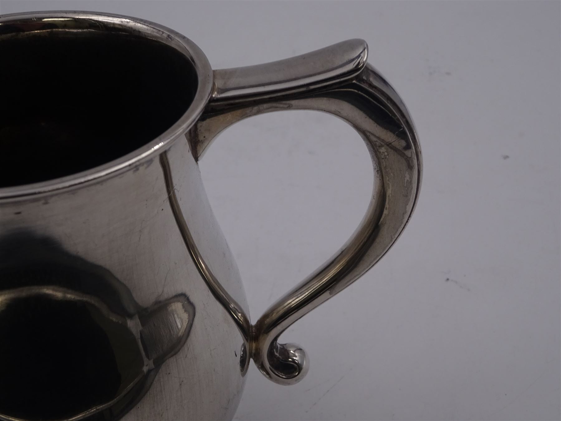 1930s silver tankard, of baluster form, with personalised engraving and C scroll handle, upon spreading circular foot, hallmarked Mappin & Webb Ltd, Sheffield 1938