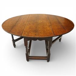 18th century large oak gateleg table, of plank top construction with visible dowels, with drop leaves to form an oval table 167cm in width, raised on block and turned supports