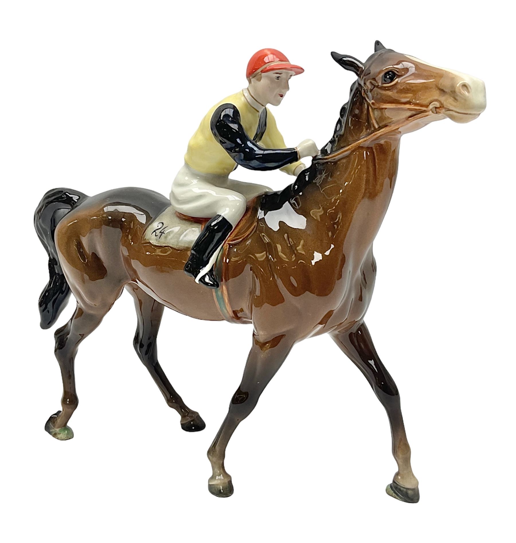 Beswick jockey on walking horse no 1037, in black white and yellow jockey colours, with printed mark beneath, H22cm