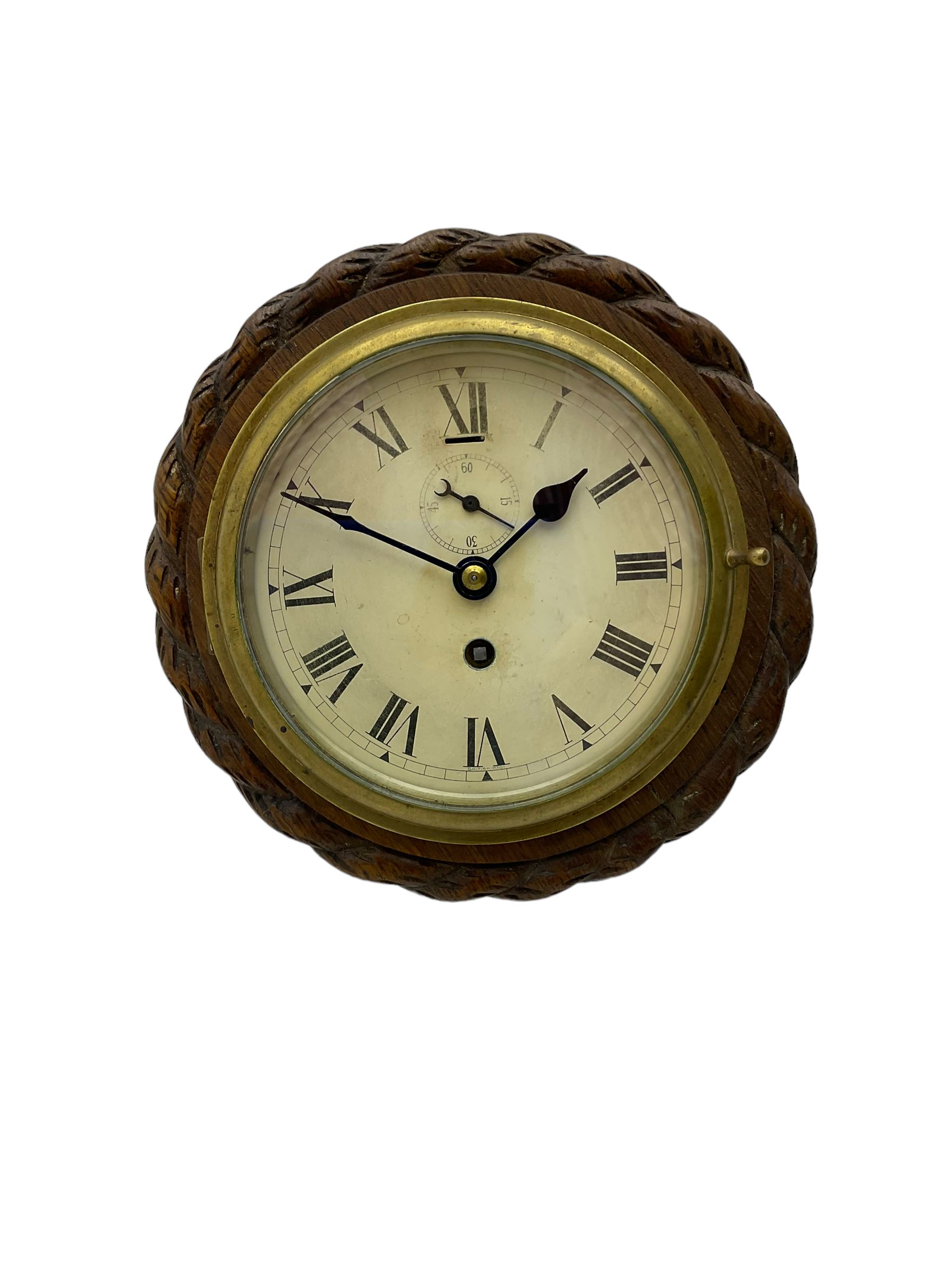 Edwardian - 8-day ships bulkhead clock and an Aneroid barometer.
In matching circular oak cases with carved rope twist bezels.
Clock with a painted metal dial, Roman numerals, minute track and steel spade hands, small seconds hand and platform regulation. Case 9