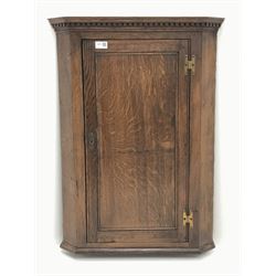 Late 19th century oak corner cupboard, projecting dentil cornice, enclosed by single panelled door, W58cm, H80cm