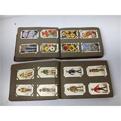 Quantity of cigarette and trade cards, housed in albums and loose, by W.D. & H.O. Wills, John Player & Sons etc, including cycling, garden hints, Britain's railways, dogs etc and various empty vintage cigarette card albums, in two boxes