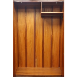  Mid 20th century walnut double wardrobe, two figured doors enclosing handing space and shelf, W123cm, H193cm, D52cm  