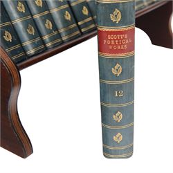 Edwardian book trough, the serpentine ends with boxwood stringing, pierced foliate keyhole shaped detail, and integrated shaped supports, housing Scott, Sir Walter, Poetical Works, Edinburgh, 1868, 12 vols, book trough 18.5cm x 38cm x 22.5cm
