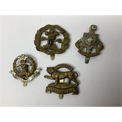 Seventeen regimental cap badges including Dorsetshire, Worcestershire, Staffordshire, Lancashire, Manchester, Middlesex, Berkshire, Bedfordshire etc (17)
