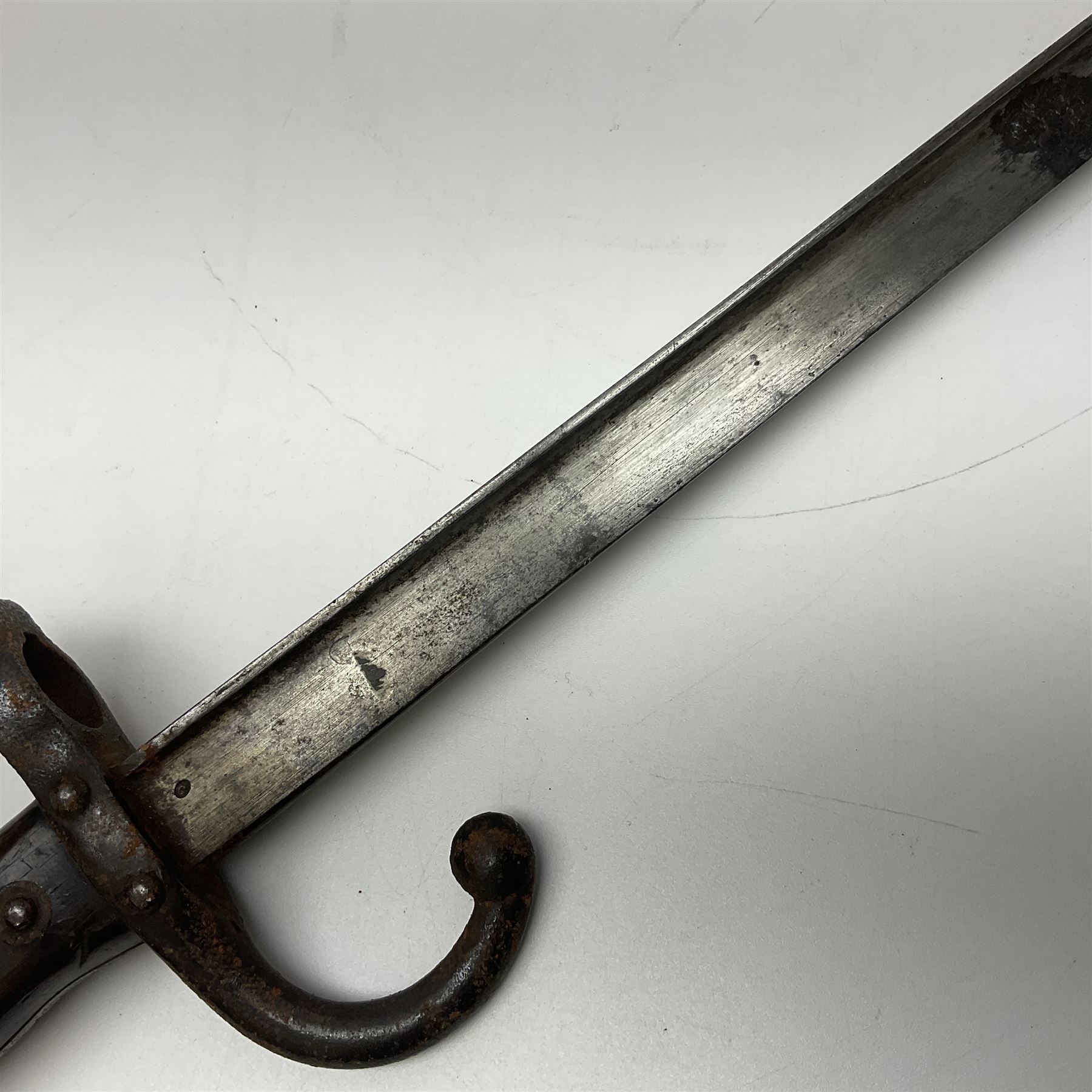 Two 19th century French model 1874 epee bayonets, each with 52cm steel blade, and armoury dates for 1880 and 1881 L64cm overall (2)