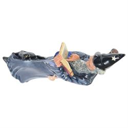 Four Royal Doulton figures, comprising The Mark Seller HN2103, The Wizard HN2877, The Blacksmith Arms HN2782, Morning Ma'am HN2895 