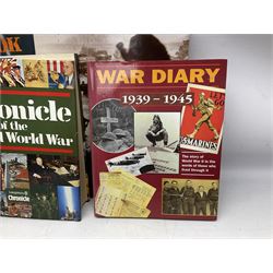 Thirty modern books of military interest including The Wartime Scrapbook 1939-1945; D-Day by Stephen Badsey; The D-Day Experience by Richard Holmes; Desert Rats by John Parker; A Most Secret Squadron by Des Curtis; Flying Colours - The Epic Story of Douglas Bader by Laddie Lucas etc; and quantity of DVDs of war and military interest