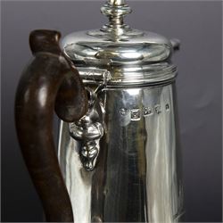 George II provincial silver coffee pot, of tapering cylindrical form, with wooden scroll capped handle, hinged cover with bell finial, and engraved crest to body, hallmarked John Webber of Plymouth, Exeter 1759, H21cm