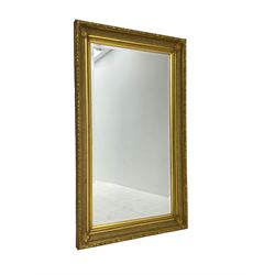 Large gilt framed wall mirror, rectangular bevelled plate, frame moulded with acanthus leaves 82cm x 143cm
