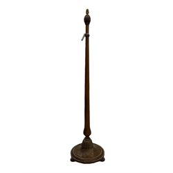 Early 20th century oak standard lamp base, of baluster form with fluted acorn finial and carved foliate decoration to the base, raised on circular plinth with bun feet