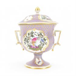 19th century twin handled cup and cover, the pedestal cup decorated with panels of exotic plumed birds in the manner of Giles, against a purple and gilt scale ground, the cover similarly decorated, H19cm