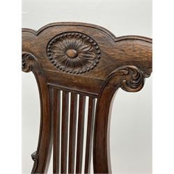 Pair late 20th century cherry wood Chippendale style elbow chairs, the shaped cresting rail relief carved with flower head, pierced lyre shaped carved with foliage, scroll carved and moulded arm supports, seat upholstered in green leather, tapering reeded supports