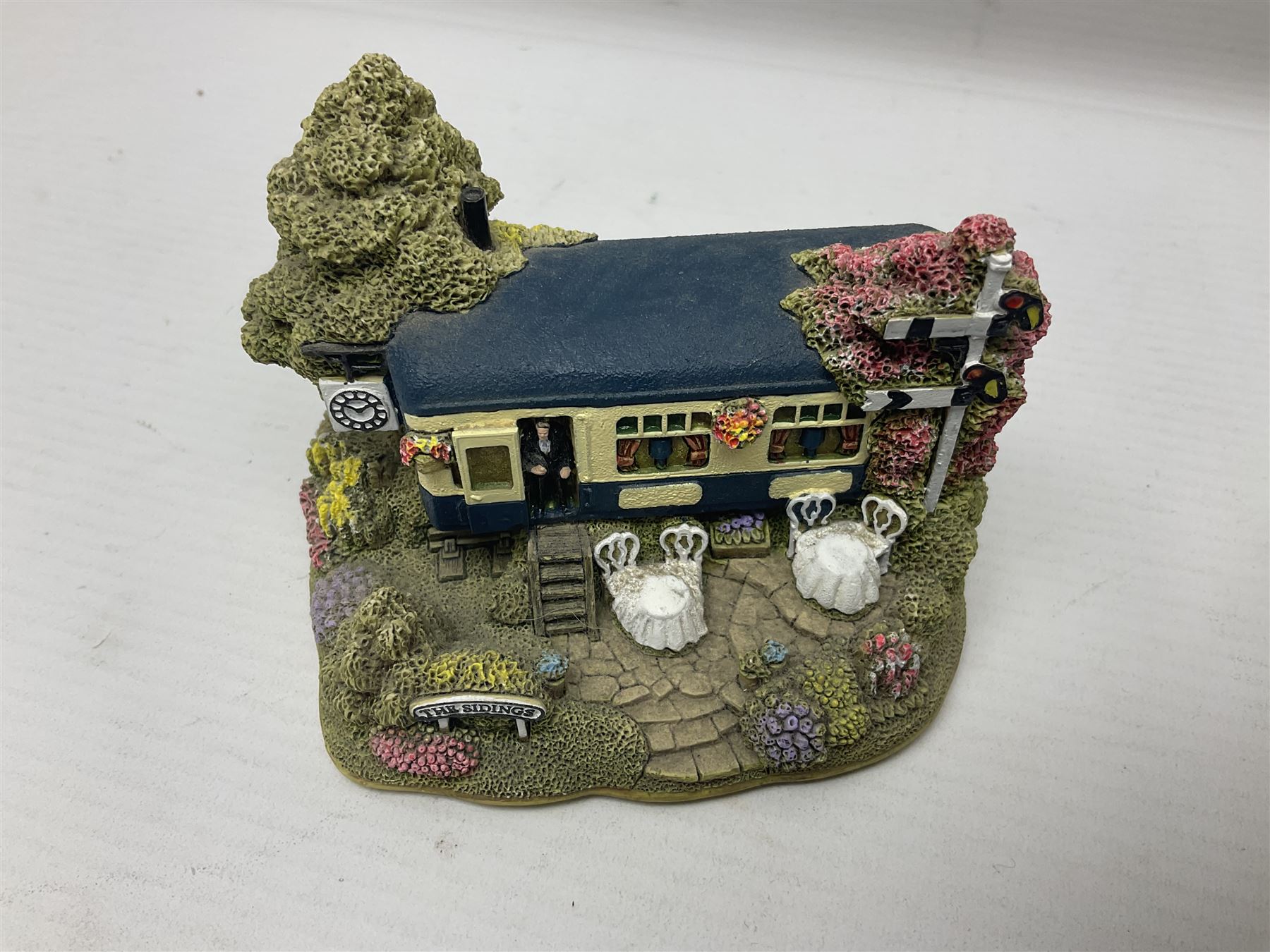 Eighteen Lilliput Lanes, including The Penny Farthing, The Pigsty, Borrowdale School, Fairy Cake Tearoom, An Apple a Day,Ladybird Cottage etc, all with original boxes 