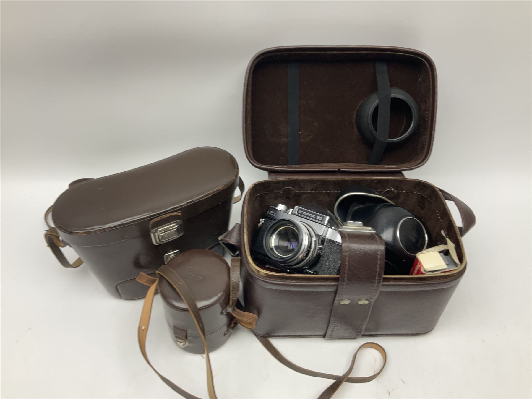 Four Zeiss Ikon camera bodies, to include, Contaflex Super B camera body, serial no. B31591, with 'Carl Zeiss Tessar 2.8/50 lens, serial no.3425553, Contaflex Super BC camera body, serial no. P81728, with 'Carl Zeiss Tessar 2.8/50' lens, serial no 4822280, etc, together with three cased lenses; 'Carl Zeiss Pro-Tessar 1:4 f=115mm' lens, serial no 3734740, 'Carl Zeiss Pr-Tessar 1:3.2 f=85mm' lens, serial no. 3647764 and 'Carl Zeiss Pr-Tessar 1:3.2 f=35mm' lens, and other Zeiss Ikon equipment 