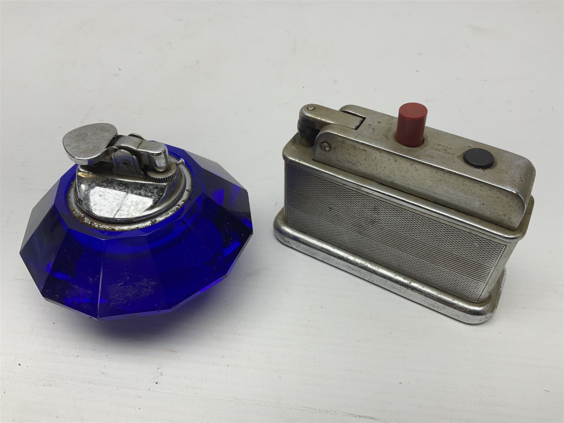 Collection of lighters, including Ronson Varaflame, Zorr Classic, Dunhill bark effect roller gas lighter, and faceted blue glass table lighter, etc