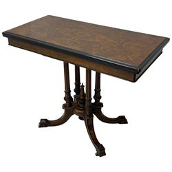 Victorian inlaid walnut card table, figured quarter veneered rectangular top with ebonised moulded edge, decorated with scrolled foliate satinwood inlays and stringing, swivel and fold-over action revealing baize lined interior, quadruple turned, fluted and foliage carved pillar supports enclosing central finial, four extending splayed supports on brass and ceramic castors, faceted feet terminals with ebonised detail