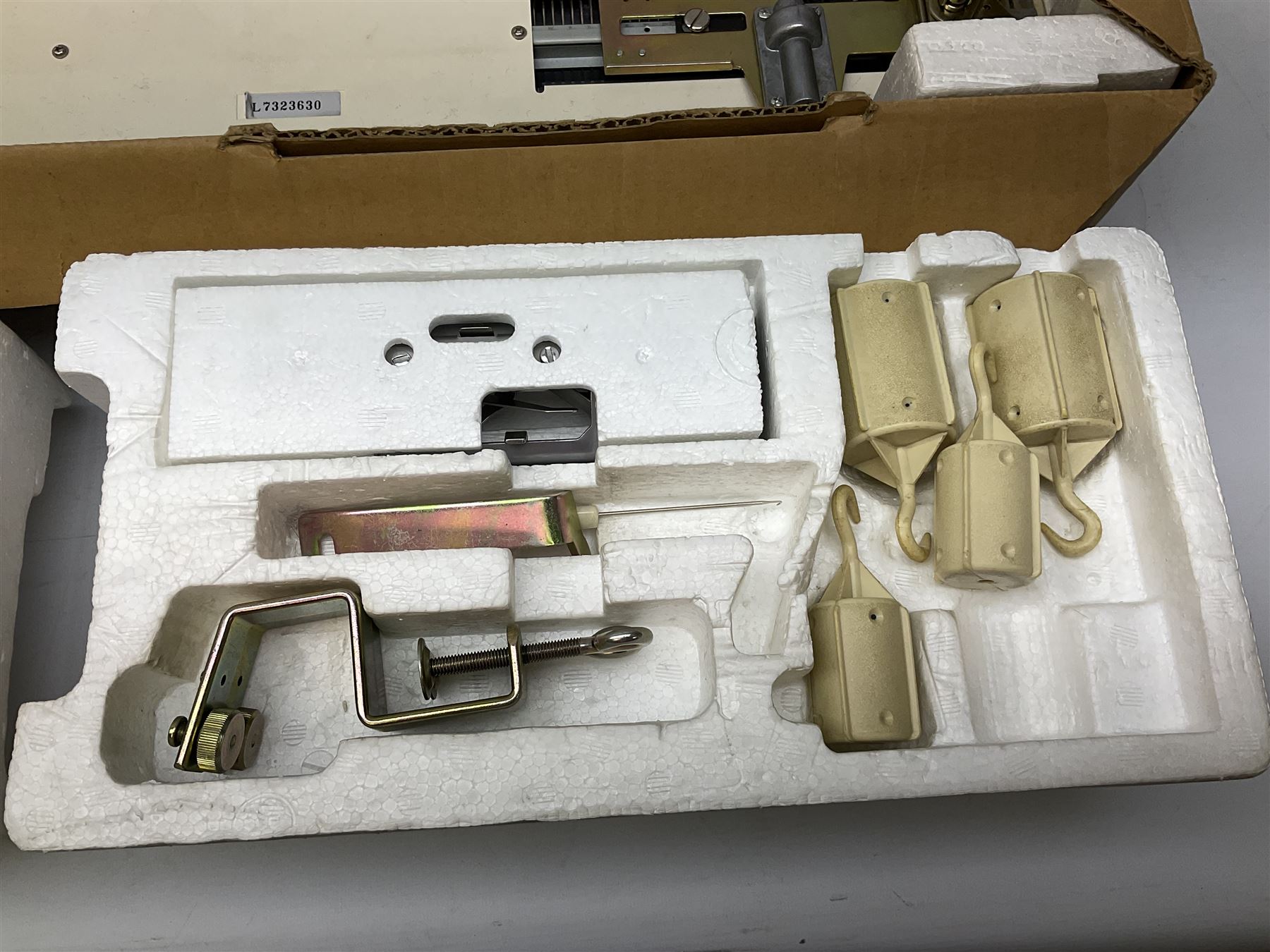  Brother cased knitting machine model KH-890 together with Brother Ribbing attachment model KH-850, knitting machine yarn cones in assorted colours, selection of knitting patterns etc