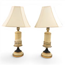 Pair of table lamps, the central column with gilt and and black bands and a foliate boarde...