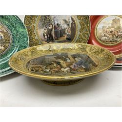 19th century Prattware table ware to include an oval footed dish decorated with a scene after Landseer 'Highland Music', retailed by James Muggleton L27.5cm, ‘The Truant’ plate after T. Webster, 'Blind Man's Buff' & 'Snap Dragon' tea plate, two side plates with malachite printed borders and others (17)