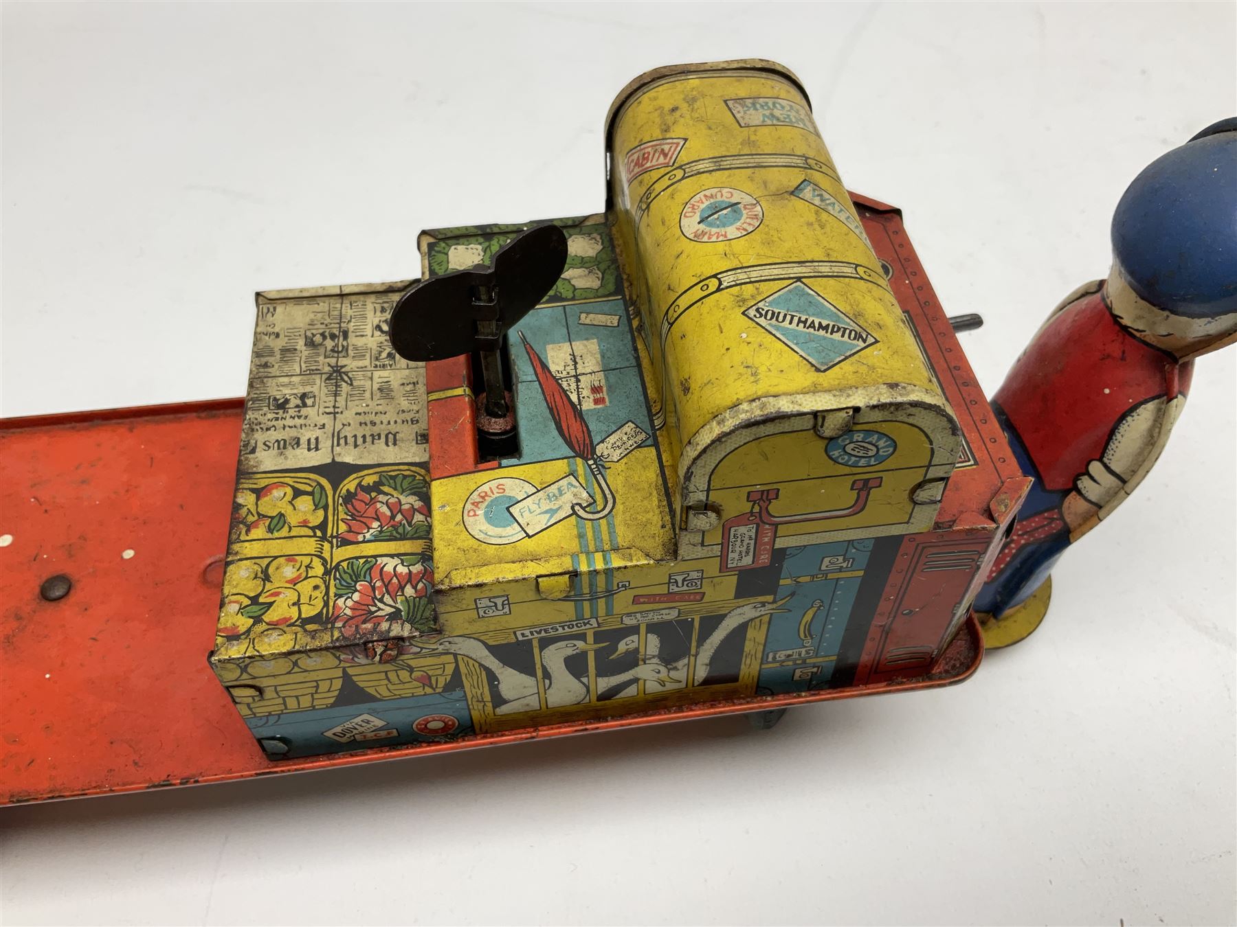 Wells Brimtoy 'Mr. Porter and his Truck' clockwork lithographed tin-plate mechanical toy L30.5cm