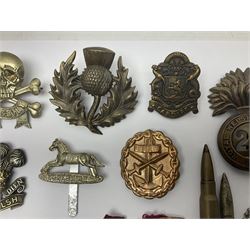 Two Edwardian hallmarked silver presentation fobs for military bugling competitions; and quantity of cap/glengarry and other badges, sweetheart brooches etc