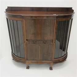  Early 20th century mahogany bureau bookcase, raised shaped back, two curved astragal glazed doors flanking single fall front enclosing fitted interior, above single drawers and two cupboard doors, shaped apron, cabriole supports on ball and claw feet, W136cm, H127cm, D42cm  