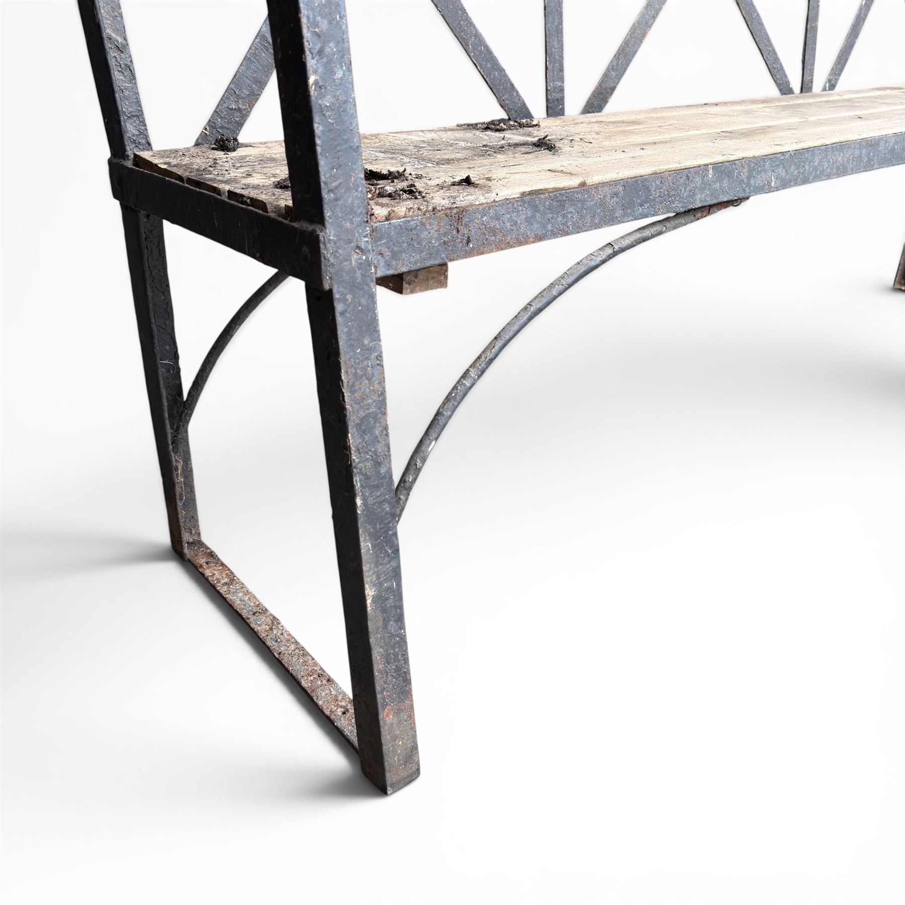 19th century and later Estate made wrought iron strapwork garden bench, the weathered wooden cresting rail over X-form strapwork back and slatted wooden seat