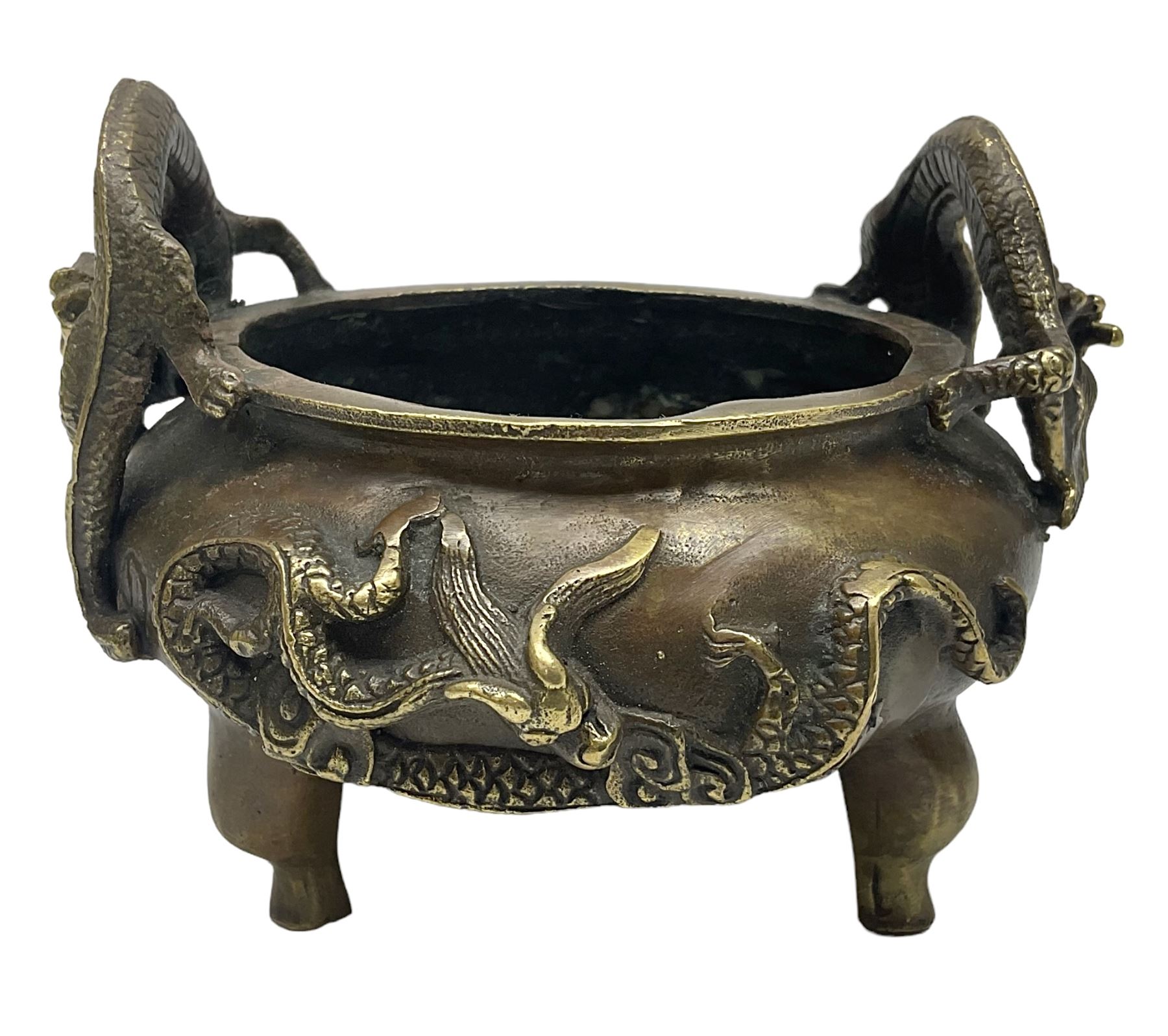 Chinese cast brass censer, with applied dragon twin handles and decoration, raised upon three feet with character mark beneath, D12cm H9.5cm