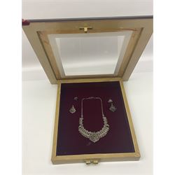 Framed Omani silver dhow sailing boat and a necklace and earring set, both in hinged wooden frames, max frame H33cm