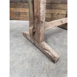 Pair of late 19th century pitch pine trestles, square tapering form in stripped finish