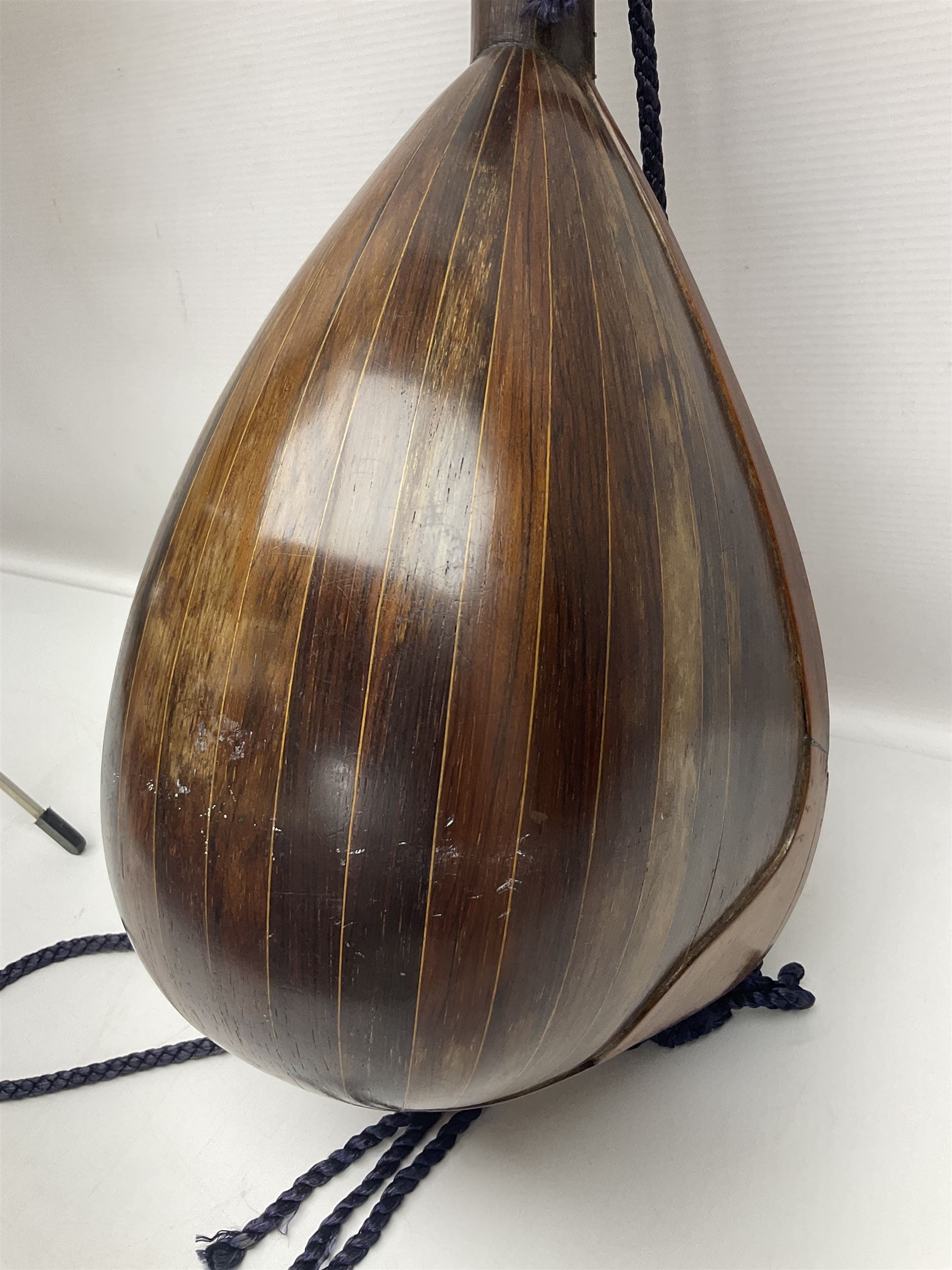 Late 19th/early 20th century Italian lute back mandolin with segmented back and spruce top; bears maker's label for Pietro Tonelli Napoli; together with a mandolin instruction booklet and a folding music stand L60.5cm