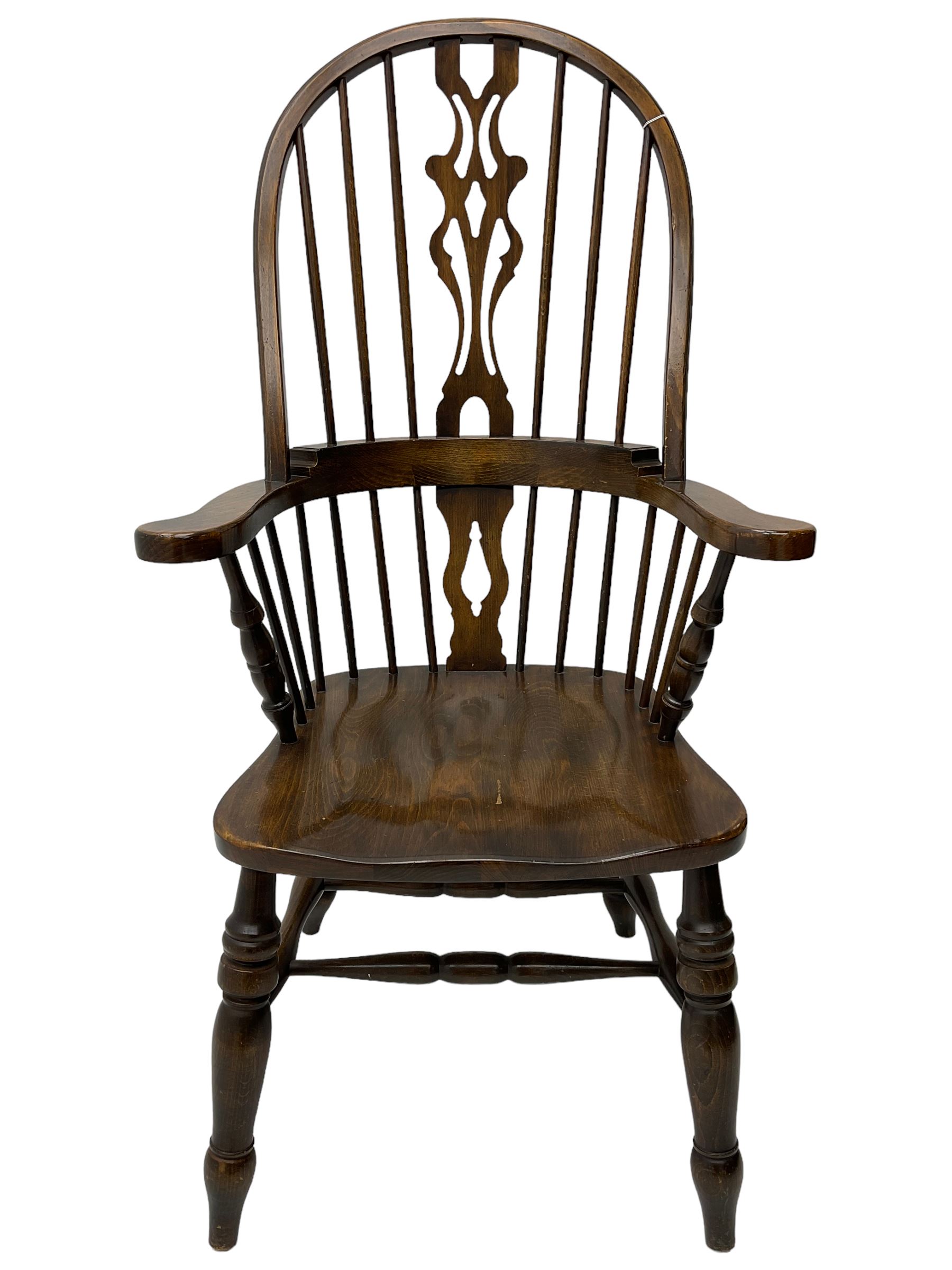 Stained beech Windsor armchair, double hoop and stick back with shaped and pieced splat back, on turned supports united by double swell-turned H stretchers