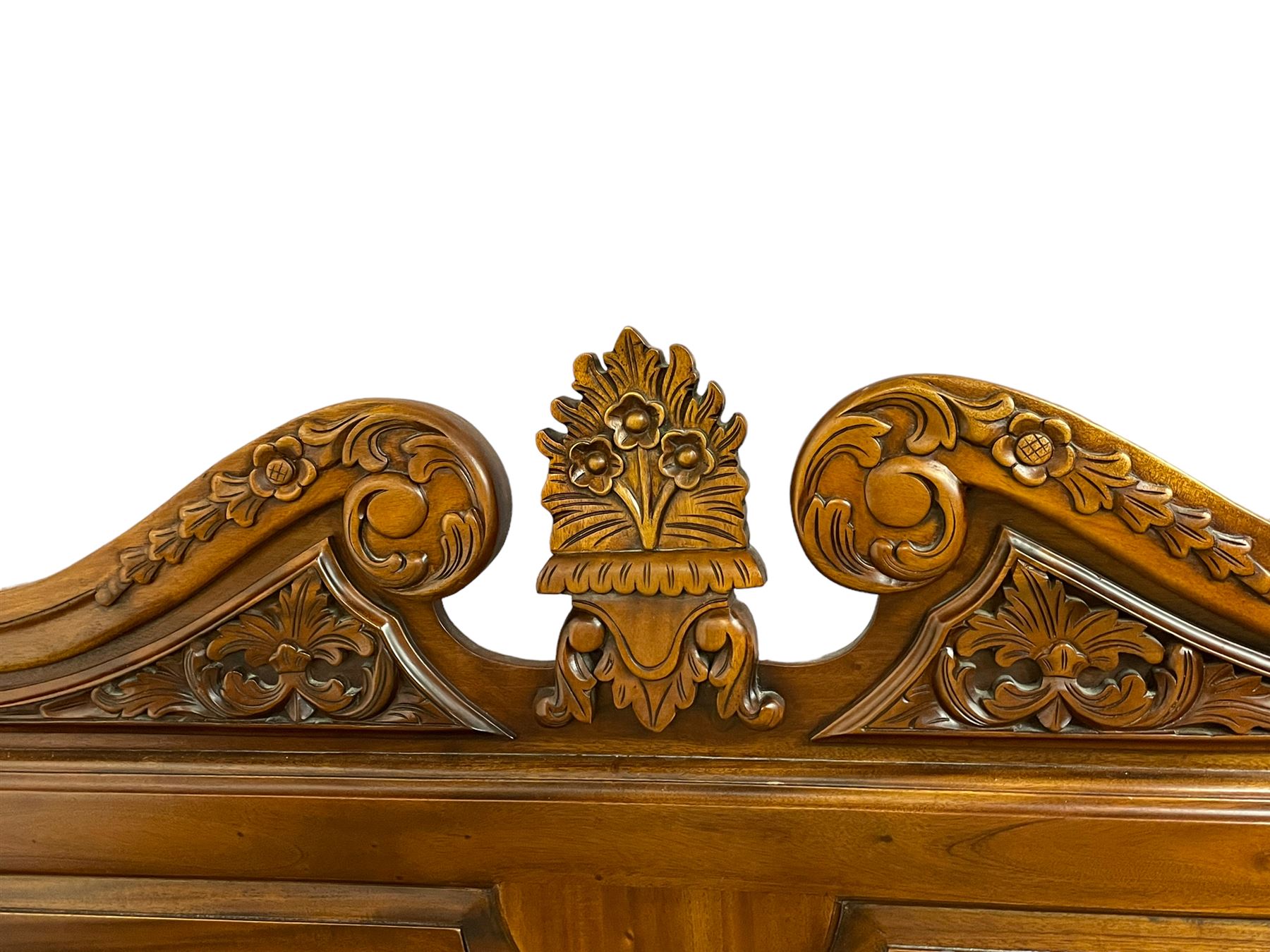 Georgian design mahogany 5' King-size four-poster bed, projecting moulded canopy top on twist-turned columns carved with acanthus leaves and flower heads, the headboard with scrolled broken swan neck pediment carved with scrolled foliage and with central anthemion, on flower head carved ball and claw front feet, with torch and foliate carved pointed finials