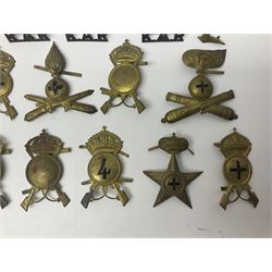 Over thirty British and Continental military metal badges; together with quantity of shoulder titles, collar dogs, rank pips, uniform buttons etc