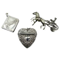 Modern silver stamp holder modelled in the form of a book, hallmarked C M E Jewellery Ltd, Birmingham import 1991, and stamped 925, together with a silver vesta case of heart form, repoussé decoration throughout with flower heads and C scrolls, stamped Sterling, and a Continental silver novelty model of a horse and racing trap, stamped 800, approximate total weight 1.65 ozt (51.5 grams)