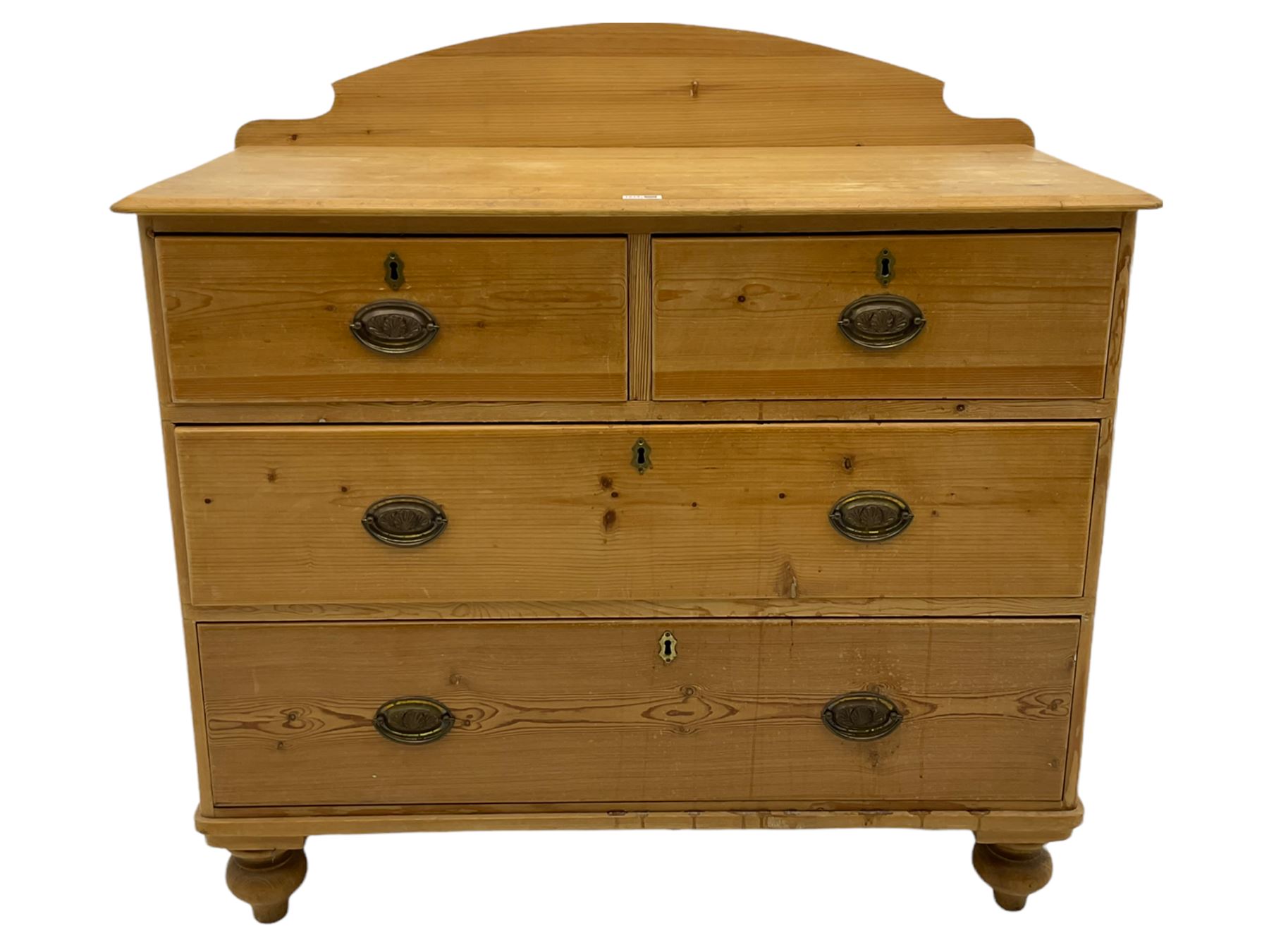 Victorian pine chest, raised shaped back, fitted with two short and two long drawers, on turned feet